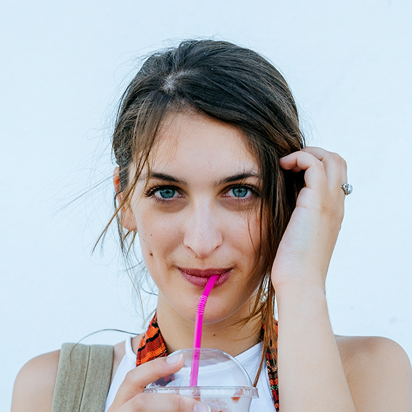 portrait-of-young-woman-drinking-a-smoothie-BTMRQTK.jpg